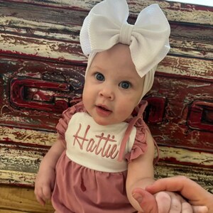 May include: A rustic wooden sign with the text "Welcome to our home" in a handwritten style. The sign features a distressed finish and a simple, inviting design, perfect for a front porch or entryway.