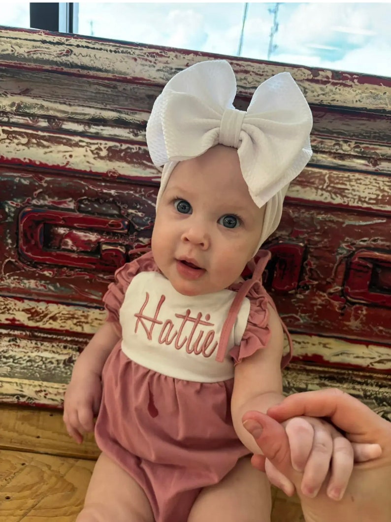 May include: A rustic wooden sign with the text "Welcome to our home" in a handwritten style. The sign features a distressed finish and a simple, inviting design, perfect for a front porch or entryway.