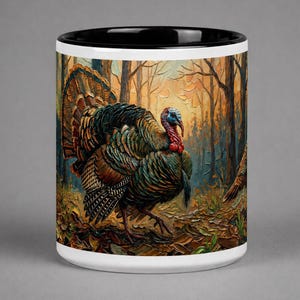 May include: White ceramic mug with a black interior. The mug displays a detailed painting of a turkey in a forest. The turkey has blue, green, and brown feathers, and a red wattle. The background shows a forest with orange and brown tones.