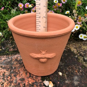 Handmade small terracotta pot with raised decoration. Hand made terracotta flower pot. image 4