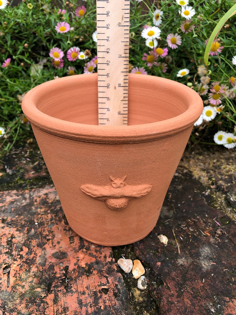 Handmade small terracotta pot with raised decoration. Hand made terracotta flower pot. image 4