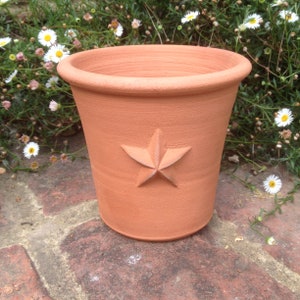 Handmade small terracotta pot with raised decoration. Hand made terracotta flower pot. image 1