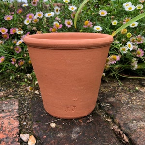 Handmade small terracotta pot with raised decoration. Hand made terracotta flower pot. image 3