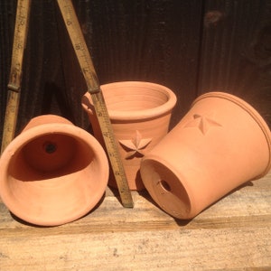 Handmade small terracotta pot with raised decoration. Hand made terracotta flower pot. image 6