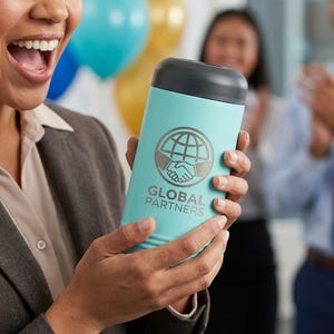 May include: A light blue insulated tumbler with a black lid is held by a person. The tumbler has a logo with a globe and handshake, and the words "GLOBAL PARTNERS". The background includes balloons and people.