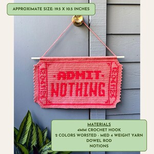 May include: A handmade, pink crochet sign with the words "ADMIT NOTHING" in red. The sign is approximately 19.5 x 10.5 inches and is suspended by a pink string from a gold doorknob. The sign is made with a 4mm crochet hook and two colors of worsted weight yarn.