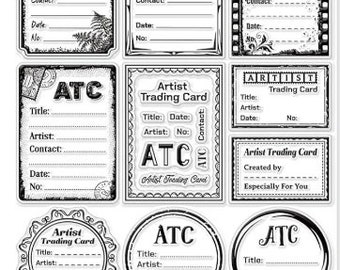 May include: A sheet of clear stamps with various designs for creating artist trading cards (ATCs). The stamps feature different frames, titles, and text such as "Artist Trading Card", "ATC", "Created by", and "Especially For You".