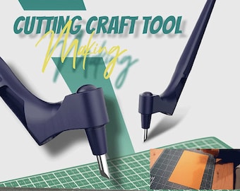 May include: A blue craft tool with a pointed tip for cutting paper. The tool is shown on a green cutting mat with a ruler and a piece of orange paper.