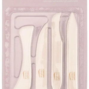 May include: A set of six bone folders for paper crafts. The set includes two 6-inch folders and two 5-inch folders. The folders are made of durable, high-quality nylon.