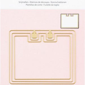 May include: A set of three gold metal die-cut frames for creating rolodex cards. The frames are nested within each other, with the largest frame on the outside and the smallest frame on the inside. The frames are designed to be used with a die-cutting machine.