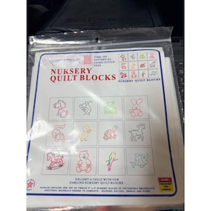 May include: A package of nursery quilt blocks featuring cross-stitch patterns of pets. The package includes twelve 8-inch by 8-inch blocks with designs of a dog, cat, frog, rabbit, duck, turtle, deer, bear, parrot, and fish.