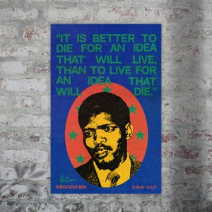 May include: A blue and red poster with a quote by  "BANCU SCEDE BIRO" in white text. The quote reads: "IT IS BETTER TO DIE FOR AN IDEA THAT WILL LIVE, THAN TO LIVE FOR AN IDEA THAT WILL DIE." The poster features a black and white portrait of a man with a dark complexion and a mustache. The man is wearing a suit and tie. The poster has a green and yellow star pattern around the portrait.