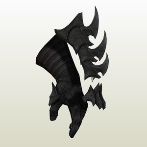 May include: A black metal gauntlet with a spiky design. The gauntlet is made of multiple pieces of metal that are connected together. The gauntlet is designed to protect the hand and forearm.