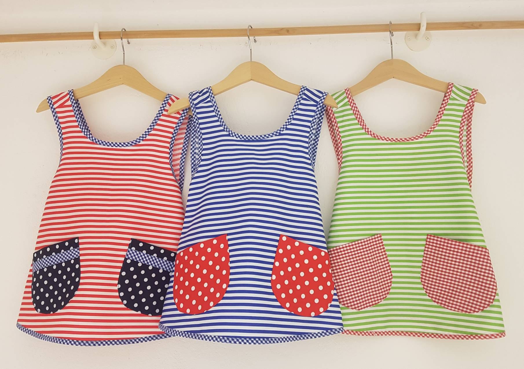 Dress, tunic, apron, in red, yellow, blue or green