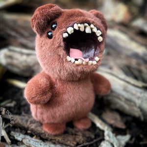 Brown stuffed animal with teeth sale