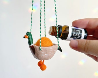 Ambientador para coche con forma de pato silvestre, accesorio para colgar en el coche hecho a mano con forma de ganso salvaje, difusor de arcilla para coche con aceite esencial y bola de lana, regalo para amantes de los patos