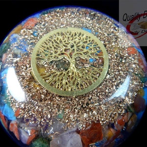 May include: A round, clear resin art piece with a gold-colored tree of life design on top. The interior is filled with colorful stones and copper shavings. The text "Quality Deals! Speedy Delivery!" is visible in the upper right corner.