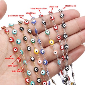 May include: A set of ten necklaces with evil eye charms. The necklaces are available in gold and silver with different colored evil eyes, including red, blue, green, black, and white.