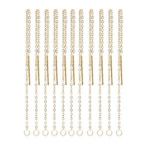 May include: Ten gold chain extenders with a small gold bar in the middle of each chain. The chains are about 2 inches long and have a jump ring at the end.