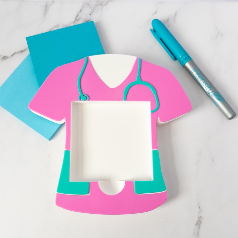 Desk Organization Tool Nurse Sticky Holder Medical Note Organizer Hospital Office Supply Practical Storage Solution Healthcare Professional Accessory Stethoscope Design Detail Pink Teal Colors Scrub Shaped Holder Standard Note Size Nursing