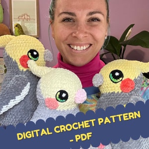 May include: A woman is holding three crocheted cockatiel amigurumi toys. The toys are grey and yellow with black eyes and red beaks. The image includes the text "DIGITAL CROCHET PATTERN - PDF".