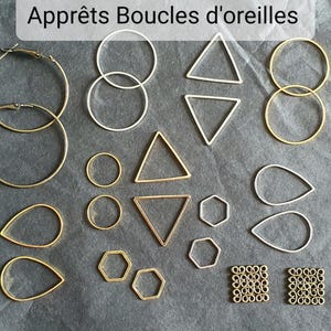 May include: A collection of earring components in gold and silver hues, featuring hoops, circles, triangles, teardrops, and hexagons. The image also shows two sets of square earring components. The text at the top says "Apprêts Boucles d'oreilles".