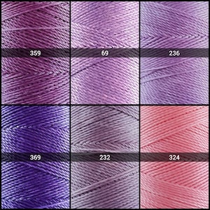 May include: Six spools of embroidery floss in various shades of purple and pink. The spools are labeled with numbers: 359, 69, 236, 369, 232, and 324.