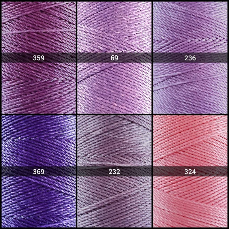 May include: Six spools of embroidery floss in various shades of purple and pink. The spools are labeled with numbers: 359, 69, 236, 369, 232, and 324.