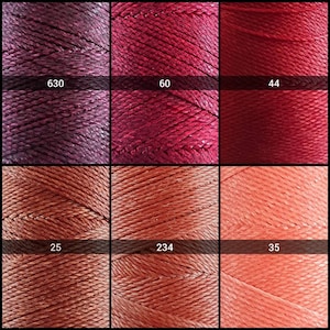 May include: Six spools of embroidery floss in various shades of red and orange. The spools are labeled with numbers: 630, 60, 44, 25, 234, and 35.