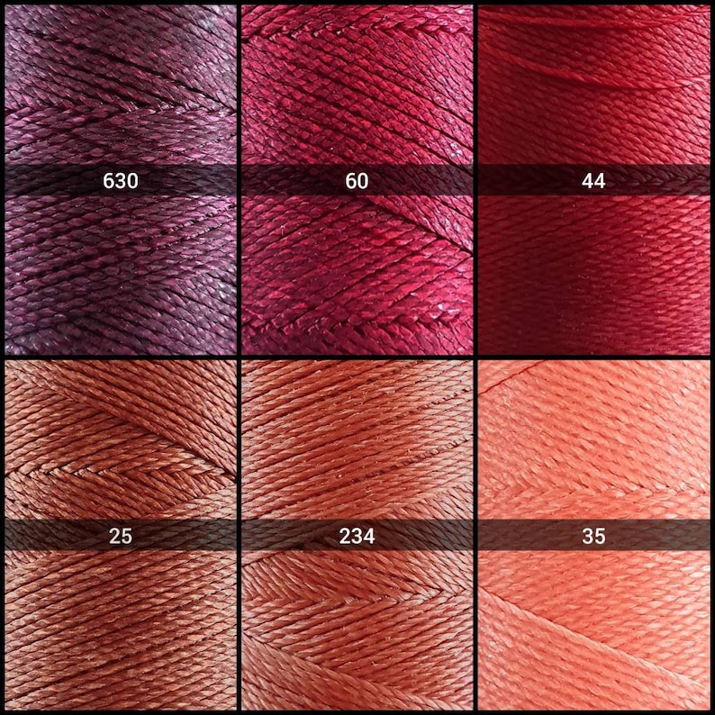 May include: Six spools of embroidery floss in various shades of red and orange. The spools are labeled with numbers: 630, 60, 44, 25, 234, and 35.