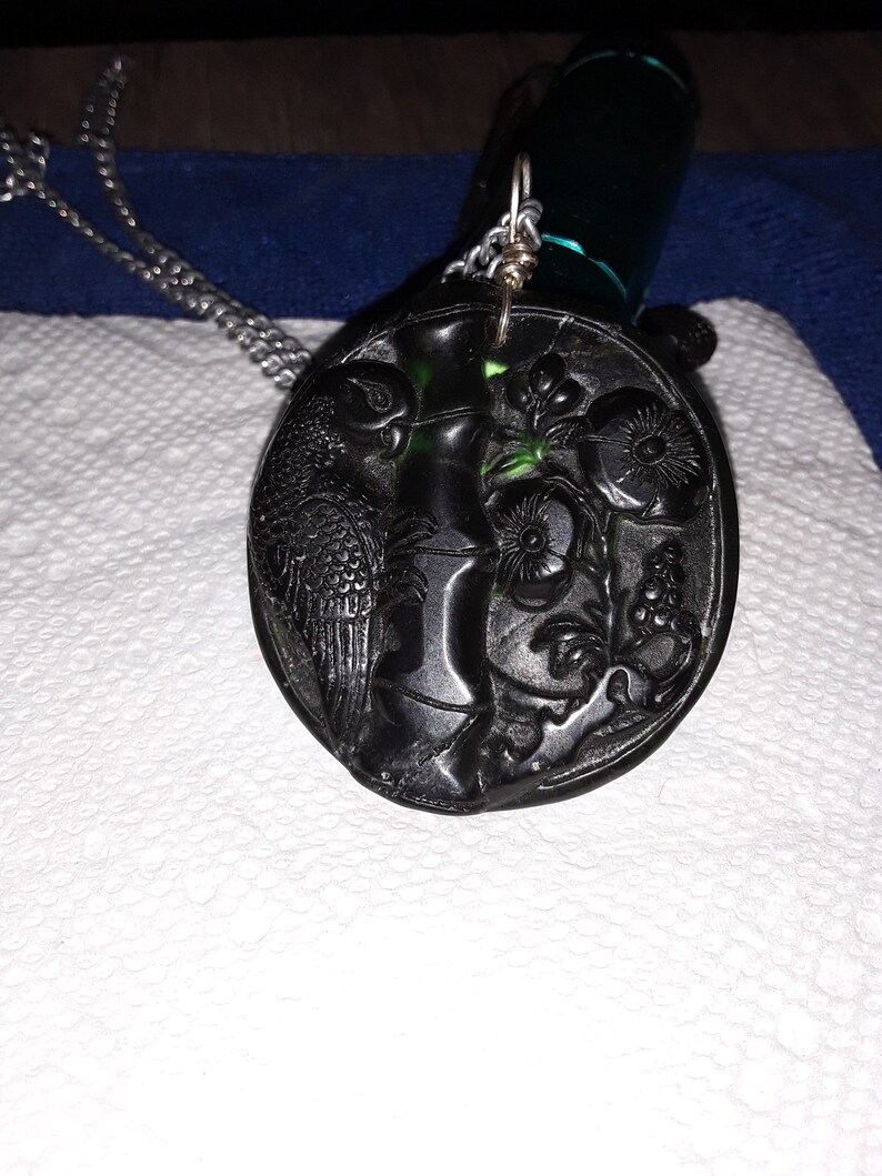 Hand made Dark Green Carved Jade Parrot Pendant on silver toned chain