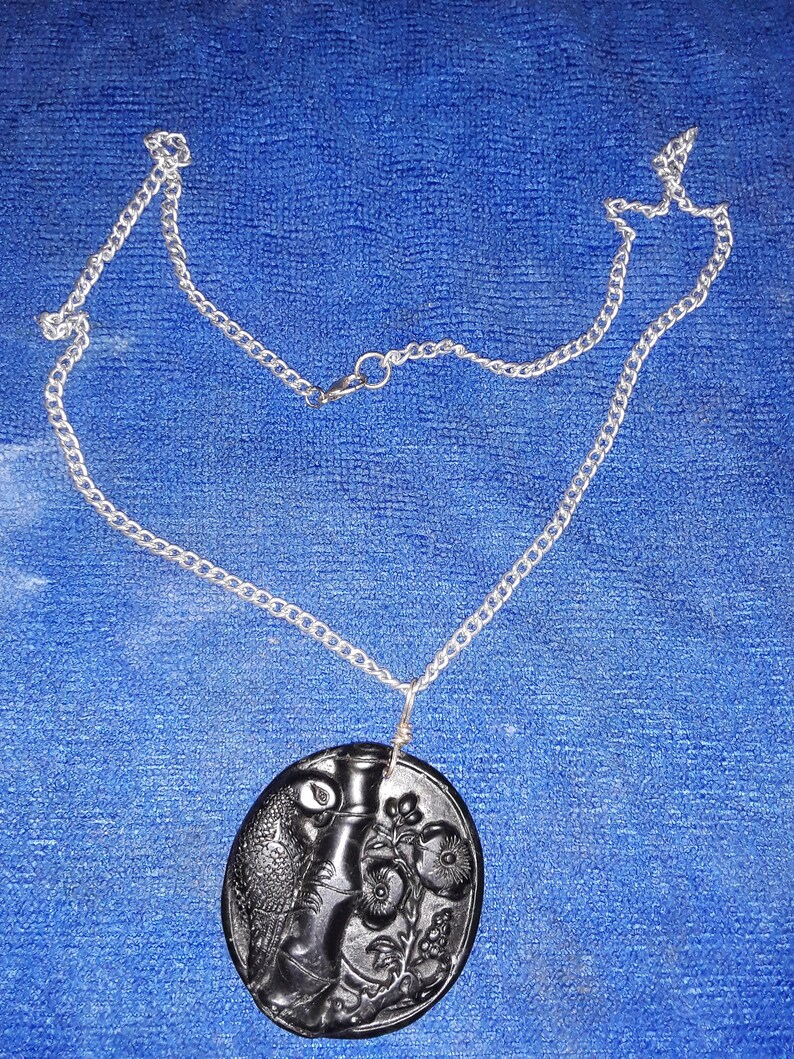 Hand made Dark Green Carved Jade Parrot Pendant on silver toned chain