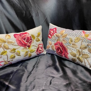 Two Embroidered Pillows with Roses