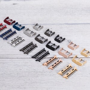 Seven colors of hardware parts of a leather Apple watch band.
