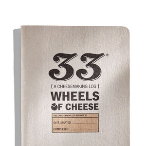 May include: A brown notebook with the text "33 (A CHEESEMAKING LOG) WHEELS OF CHEESE" printed on the front cover. The notebook has a blank space for the owner's name, the date started, and the date completed.