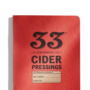 May include: A red notebook with the title "33 (A CIDER-MAKING LOG) CIDER PRESSINGS". The notebook has a brown label with the text "THIS CIDER MAKING LOG BELONGS TO", "DATE STARTED", and "COMPLETED".