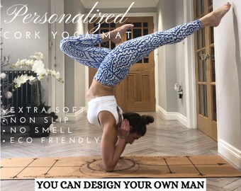 May include: A woman demonstrates a yoga pose on a cork yoga mat. The mat is brown with a circular design and a compass-like pattern. The text "Personalized Cork Yoga Mat" is at the top of the image. The text "Extra Soft, Non Slip, No Smell, Eco Friendly" is on the left side of the image. The text "You Can Design Your Own Mat" is at the bottom of the image.