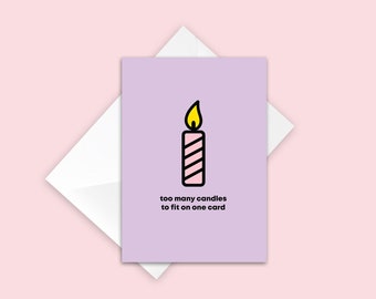 May include: A purple birthday card with a pink and white striped candle with a yellow flame. The text on the card reads "too many candles to fit on one card".