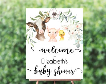 May include: Welcome to Elizabeth's baby shower sign with a watercolor illustration of a cow, pig, duck, and lamb surrounded by greenery and flowers.
