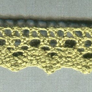 May include: A close-up of a gold crochet trim with a scalloped edge.