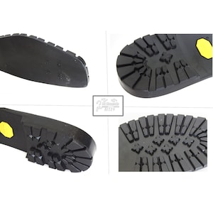 May include: Close-up view of a black rubber shoe sole with a yellow accent. The sole has a textured pattern with diamond-shaped grooves and a raised heel.