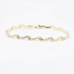 7.5&quot; Wavy Hugs and Kisses Design Stampato Bracelet Real 10K Yellow White Gold