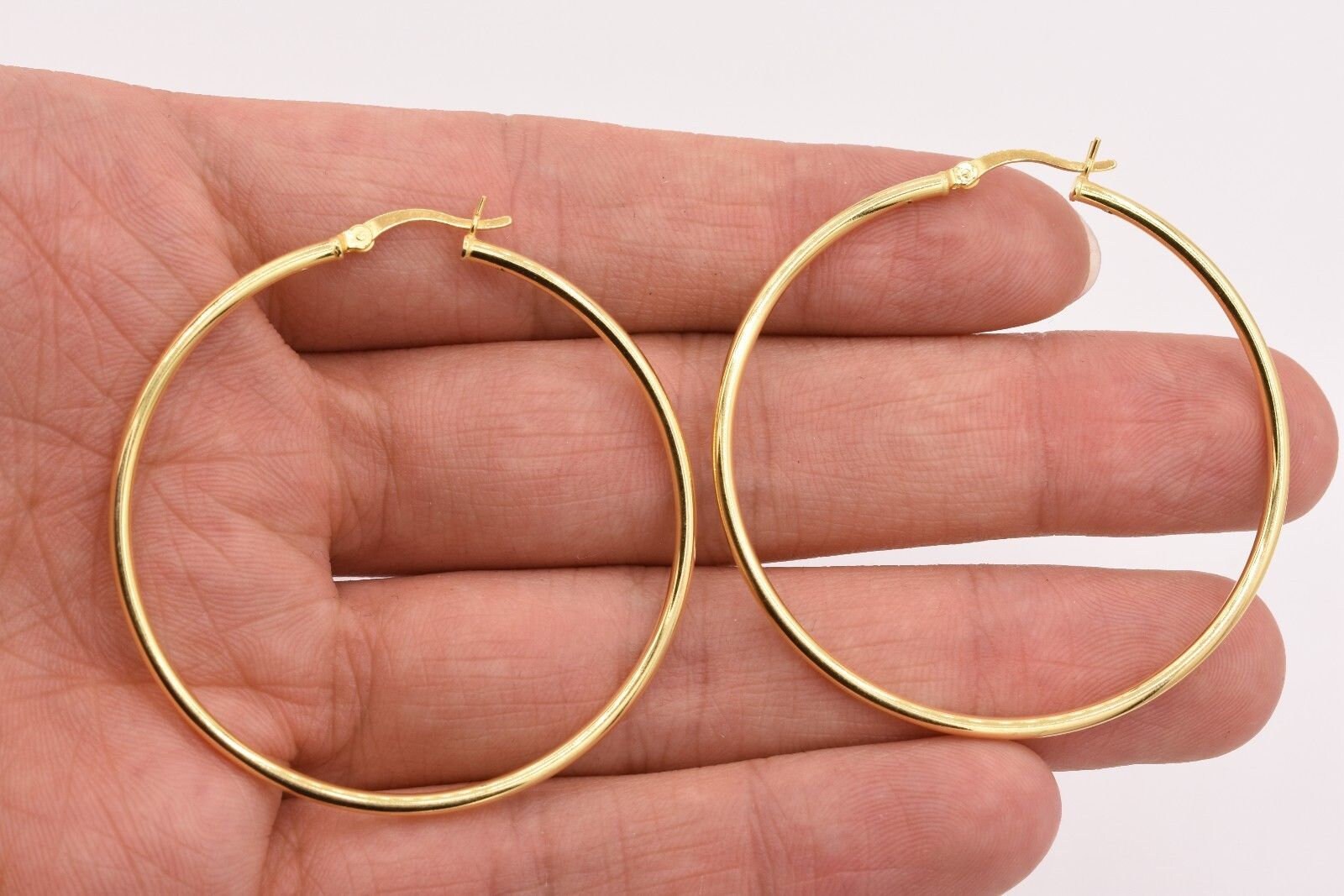 thumbnail interactive-video image 1 of Goldum NYC 14K Yellow Gold-Plated Sterling Silver Hoop Earrings - 2mm X 14mm 1 of 5