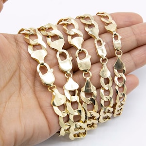 May include: Five gold chains of different lengths and widths, all with a curb link design. The chains are stacked on top of each other and are labeled with "10KT" markings.