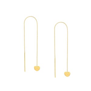 May include: A pair of gold-toned threader earrings featuring a delicate chain design. Each earring consists of a thin, flexible metal wire that loops through the ear, ending with a small, polished gold heart charm suspended at the bottom.