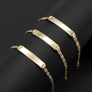 May include: Three gold chain bracelets with a rectangular nameplate charm. The nameplates are blank and ready to be engraved.