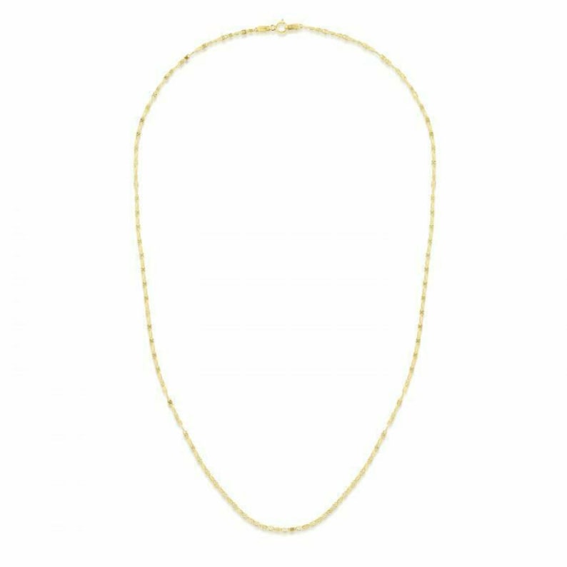 May include: A gold chain necklace with a delicate, twisted design.
