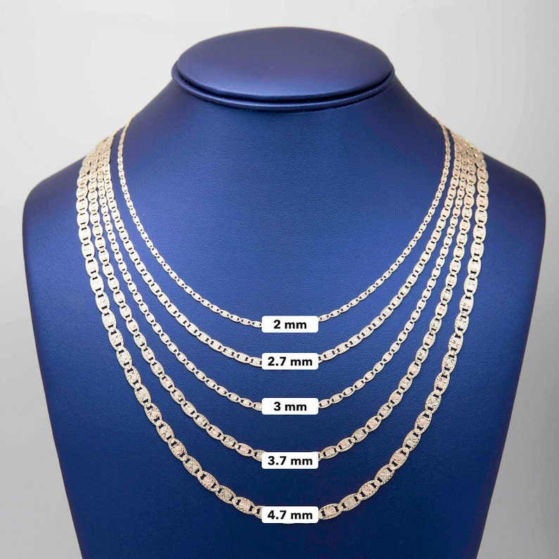 May include: Five gold chains of different widths, displayed on a blue mannequin. The chains are 2 mm, 2.7 mm, 3 mm, 3.7 mm, and 4.7 mm wide.