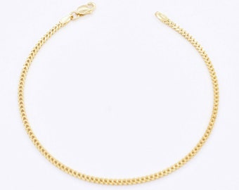 May include: A gold chain bracelet with a lobster clasp.