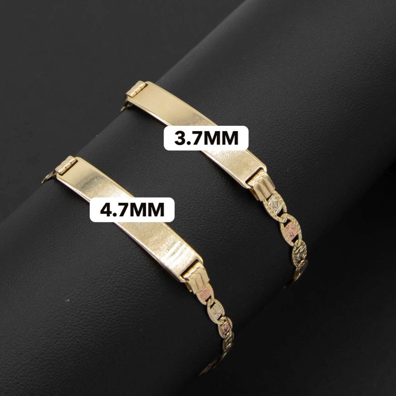 May include: Two gold bracelets with a rectangular nameplate. The top bracelet has a nameplate that reads "3.7MM" and the bottom bracelet has a nameplate that reads "4.7MM".
